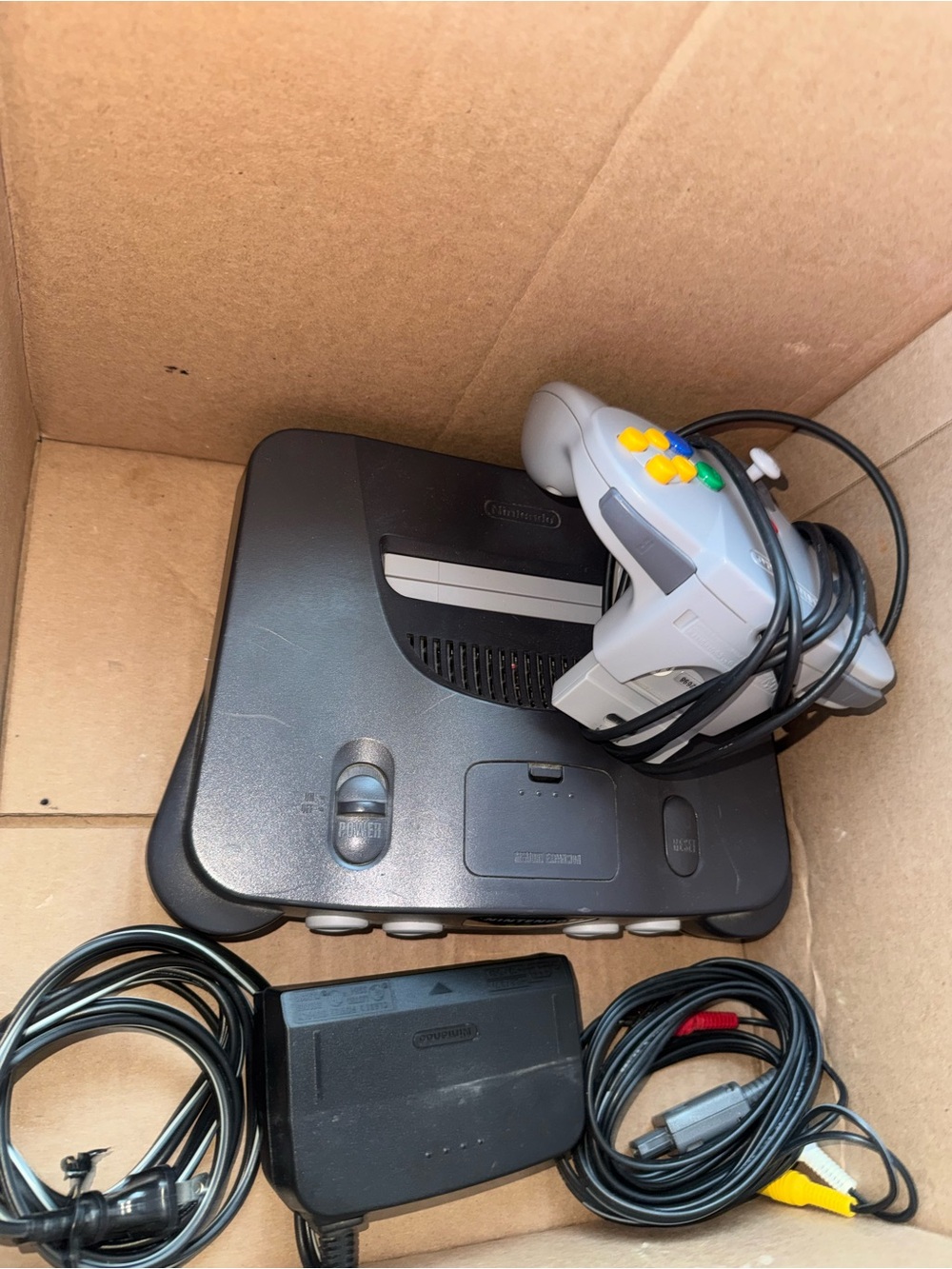 Nintendo N64 Console with Gray Controller and Yellow Buttons